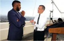  ?? GARY CORONADO/LOS ANGELES TIMES VIA AP ?? Los Angeles Mayor Eric Garcetti, right, talks with Michael Tubbs, founder of Mayors for a Guaranteed Income, after holding his annual State of the City address from the Griffith Observator­y, in Los Angeles in April.