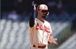  ?? RYAN SUN – THE ASSOCIATED PRESS ?? The Angels’ Randal Grichuk gestures after hitting a double in the first inning on Sunday.