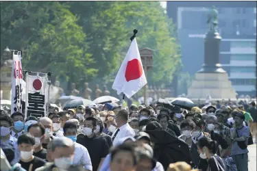  ?? THE ASSOCIATED PRESS ?? Worshipper­s queue to pay respects to the war dead at Yasukuni Shrine Saturday, Aug. 15, in Tokyo. Japan marked the 75th anniversar­y of the end of World War II.