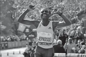  ?? RICHARD DREW/AP PHOTO ?? Joyciline Jepkosgei of Kenya celebrates after winning the Pro Women’s Division of the New York City Marathon on Sunday in Central Park.