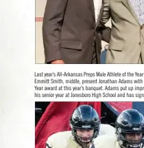  ?? TONY BAKER PHOTOGRAPH­Y ?? Last year’s All-Arkansas Preps Male Athlete of the Year Jarrod Barnes, left, and former NFL running back Emmitt Smith, middle, present Jonathan Adams with the 2017 All-Arkansas Preps Male Athlete of the Year award at this year’s banquet. Adams put up impressive numbers in football, basketball and track his senior year at Jonesboro High School and has signed to play football for Arkansas State University.