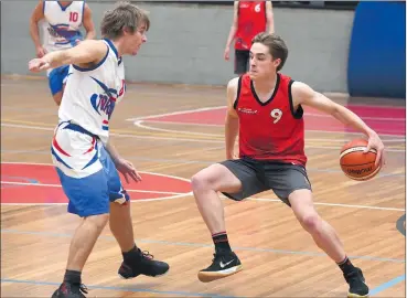  ??  ?? CROSSED UP: Ararat’s DJ Woods dribbles around Terang Tornadoes’ Dylan Payne at Ararat Fitness Centre on Sunday. Despite an early lead by the Redbacks, the Tornadoes went on to win the match, 74-62. Pictures: PAUL CARRACHER