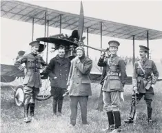  ??  ?? Flying First Lord: Churchill, centre, in flying gear, after landing in an Army biplane in 1914