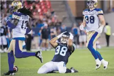  ?? NATHAN DENETTE/THE CANADIAN PRESS ?? Ian Wild, right, and Blue Bombers defence have been winning the turnover battle in their past three wins.
