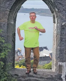  ??  ?? Brendan O’Hara belts out I Would Walk 500 Miles at McCaig’s Tower in Oban.