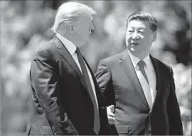  ?? Alex Brandon Associated Press ?? PRESIDENT Trump and his Chinese counterpar­t, Xi Jinping, in Florida last week. “I think [Xi] means well and wants to help” with North Korea, Trump said.