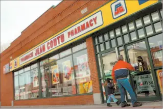  ?? SIMON HAYTER / BLOOMBERG NEWS ?? Shares of drugstore retailer Jean Coutu plummetted after the company announced a 50% drop in firstquart­er earnings. The firm plans to partially offset the loss by selling 30 commercial strip malls.