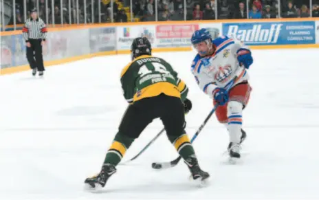  ?? CITIZEN PHOTO BY VICKI BROWN ?? Dustin Manz of the Prince George Spruce Kings tries to fire the puck through Powell River Kings defender Carmine Buono on Friday night at Rolling Mix Concrete Arena. The teams clashed in Game 1 of a BCHL semifinal series.