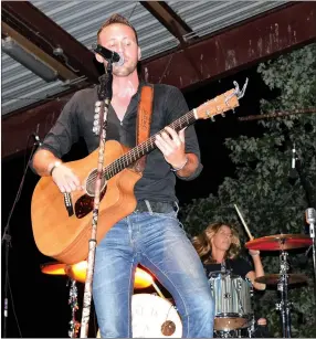  ?? Photo by Mike Eckels ?? Drew Baldridge headlined at this year’s Decatur Barbecue on Aug. 6 at Veterans Park in Decatur. Baldridge performed a mix of his own songs and a few fan favorites from other Nashville artists.