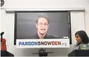  ?? SPENCE PLATT/GETTY IMAGES ?? Speaking via video link to NewYork City on Wednesday, Edward Snowden addresses the launch of a campaign calling for President Obama to pardon him.