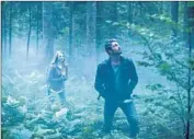  ?? James Dittiger
Gramercy Pictures ?? NATALIE DORMER and Taylor Kinney venture into an eerie Japanese woodland in “The Forest.”