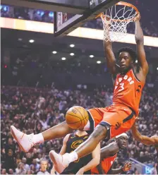  ??  ?? Raptor OG Anunoby finishes a jam on Monday. With 12 points, the forward was among five Toronto players to reach double digits in scoring.