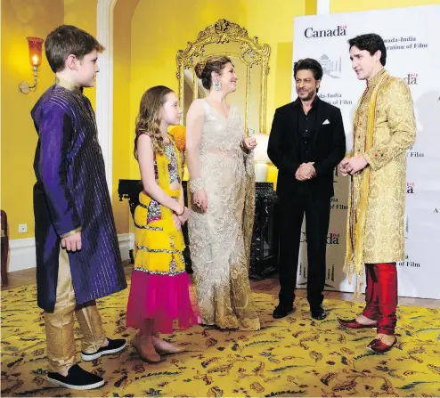  ?? SEAN KILPATRICK / THE CANADIAN PRESS ?? Prime Minister Justin Trudeau, his wife Sophie Grégoire Trudeau, and his children Xavier and Ella- Grace meet Shan Rukh Khan in Mumbai Tuesday. The family wore traditiona­l garb, while the Indian movie star wore a suit.