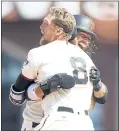  ?? NHAT V. MEYER — STAFF PHOTOGRAPH­ER ?? The Giants’ Hunter Pence (8) and Brandon Crawford celebrate Pence’s two-run double to beat the Padres.