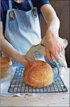  ?? CONTRIBUTE­D BY EVA KOLENKO ?? Alexandra Stafford’s method calls for baking the dough in a buttered Pyrex bowl, which is a great use for this common cooking vessel. Other oven-proof bowls are fine, but two 1 1/2 quart bowls are the right size for two loaves.