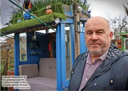  ?? JOSEPH RAYNOR ?? Graham Beaumont at his allotment plot in Carlton in front of the wooden arbour he built