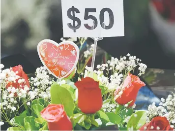  ??  ?? Roses on sale for Valentine’s Day in Sydney. — AFP photo