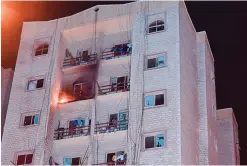  ??  ?? KUWAIT: Flames coming out from a seventh floor apartment in Khaitan.