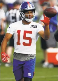  ?? Adam Hunger / Associated Press ?? Giants wide receiver Golden Tate makes a catch during practice in East Rutherford, N.J., on May 20.