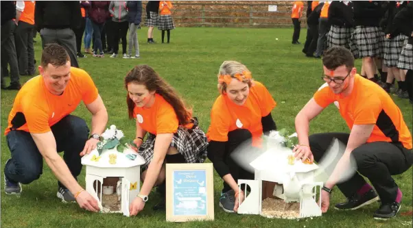  ??  ?? Brendan Cullen, Adelina Mihalachi, Adrienne Casey and Ben D’Arcy releasing the doves at Creagh College.