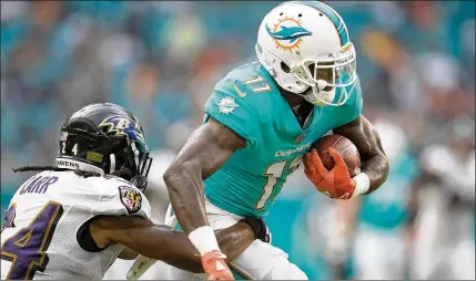  ?? ALLEN EYESTONE / THE PALM BEACH POST ?? Miami Dolphins wide receiver DeVante Parker played 13 games in 2017, averaging 52 receiving yards per game. His yards per catch were a career-low 11.8.