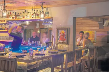  ??  ?? TASTY TREAT: Extra Virgin bistro bar in Cruz Bay serves modern cuisine in chic surroundin­gs.