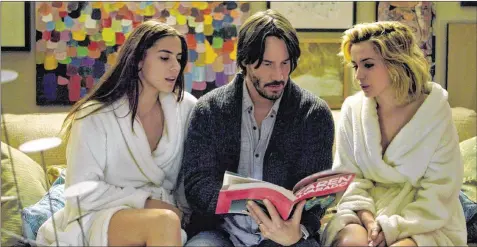  ?? CONTRIBUTE­D BY LIONSGATE PREMIERE ?? Genesis (Lorenza Izzo, from left), Evan (Keanu Reeves) and Bel (Ana De Armas) star in the thriller “Knock Knock.”