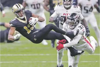  ?? FILE PHOTOS BY BRETT DUKE/ASSOCIATED PRESS ?? Saints wide receiver Michael Thomas holds on to a catch against Falcons free safety Ricardo Allen on Nov. 22 in New Orleans. Allen has teamed up this year with Falcons quarterbac­k Matt Ryan after the killing of George Floyd by a white police officer as part of the Falcons’ social justice committee. They support after-school programs in underprivi­leged neighborho­ods in Atlanta.