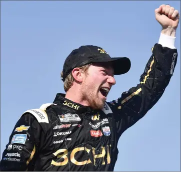  ?? LOGAN RIELY — GETTY IMAGES ?? Tyler Reddick celebrates in victory lane after winning the NASCAR Cup Series Kwik Trip 250at Road America on Sunday.