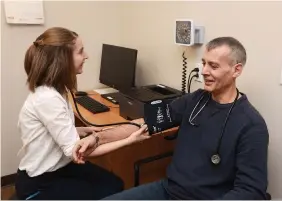  ?? SABRINA BYRNES TORSTAR FILE PHOTO ?? A family medicine senior resident meets with a patient at the Bowmanvill­e Health Centre. New data released Thursday by the Canadian Resident Matching Service shows fewer vacancies among medical school graduate positions in Canada this year.