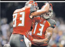  ??  ?? HAVE A NICE BAY: Receivers Vincent Jackson (83) and Mike Evans (13) celebrate a touchdown during the Buccaneers upset of the Saints last week in New Orleans. Sunday, they should cover against the Texans in Houston, write Richard Witt.