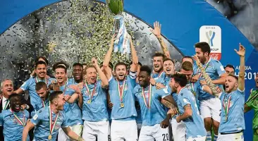  ?? — reuters ?? Super win: senad lulic lifting the Italian super cup trophy as lazio celebrate beating Juventus in riyadh on sunday.