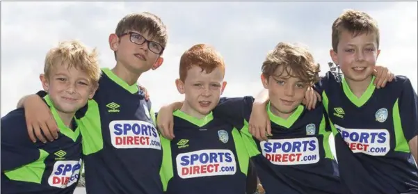  ??  ?? Luke Herlihy, Sam Herlihy, Jack O’Hare, Conor Kearney and Conor Heffernan having a good time at the FAI summersocc­er camp at the Carslile Grounds.