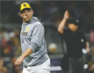  ?? The Associated Press ?? END OF THE LINE: San Diego Padres manager Andy Green walks off the field Friday during the eighth inning of the team’s baseball game against the Arizona Diamondbac­ks in San Diego.