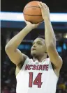  ?? ETHAN HYMAN/THE NEWS & OBSERVER ?? NC State’s Casey Morsell prepares to shoot a 3-point basket during the first half of a victory against Louisville on Thursday night.