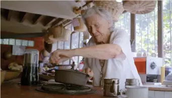  ??  ?? LA COCINA: Diana Kennedy works in her kitchen in the documentar­y ‘Diana Kennedy: Nothing Fancy.’ Below, Kennedy is seen making tortillas in the 1970s.