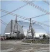  ?? REUTERS ?? The remains of the destroyed nuclear reactor at Chernobyl are now encased in a giant steel dome.