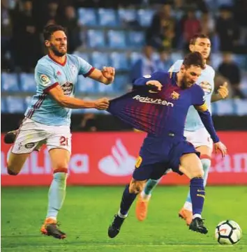  ?? AP ?? Barcelona’s Lionel Messi came off the bench in the second half to give the league leaders a boost against Celta Vigo, but Sergie Roberto was sent off to allow Celta to equalise.