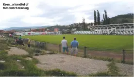  ??  ?? Keen...a handful of fans watch training