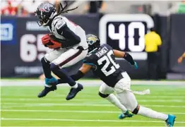  ?? BOB LEVEY GETTY IMAGES ?? The Rams’ Jalen Ramsey and Cardinals’ DeAndre Hopkins were AFC South rivals with Jacksonvil­le and Houston. Now the rivalry is renewed in NFC West.