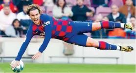  ?? (AP Photo/Joan Monfort, FILE) ?? In this file photo dated Feb. 22, 2020, Barcelona’s Antoine Griezmann falls during a Spanish La Liga soccer match against Eibar at the Camp Nou stadium in Barcelona, Spain.