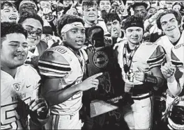  ?? BRIAN O'MAHONEY/FOR THE CHICAGO TRIBUNE ?? Nazareth players celebrate after beating St. Charles North for the Class 7A state title.