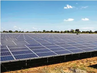  ?? —AFP ?? SOROTI: Solar Panels are pictured during the inaugurati­on of the Soroti Power plant in Soroti District about 300 kilometers Northeast of the Capital Kampala, on December 12, 2016.