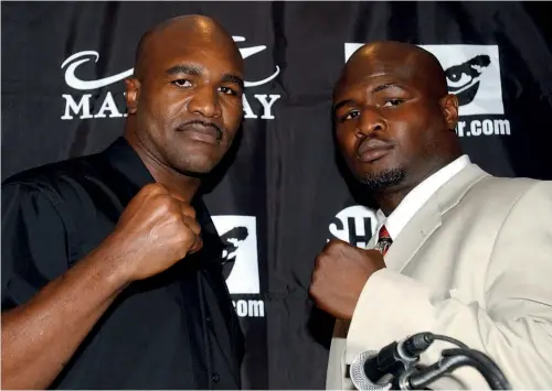  ?? Photos: GETTY IMAGES ?? CROSSROADS: Holyfield and Toney brandish their weapons before battle