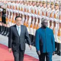  ??  ?? Solomon Islands Prime Minister Manasseh Sogavare, right, and Chinese Premier Li Keqiang inspect honour guards during a welcome ceremony.