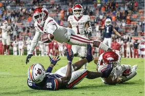  ?? AP Photo/Butch Dill ?? Arkansas defensive back Hudson Clark breaks up a pass intended for Auburn wide receiver Seth Williams (18) during the second half of an NCAA college football game Saturday in Auburn, Ala.