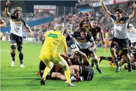  ?? Photo / Photosport ?? Folau Fainga’a scores for the Brumbies at Waikato Stadium.