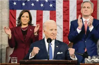 ?? Jacquelyn Martin / Associated Press ?? President Joe Biden delivers the State of the Union address to a joint session of Congress at the Capitol on as Vice President Kamala Harris and House Speaker Kevin McCarthy applaud.