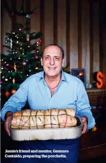  ??  ?? Jamie’s friend and mentor, Gennaro Contaldo, preparing the porchetta.