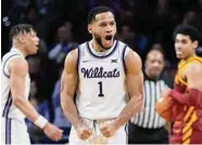  ?? Travis Heying/Associated Press ?? Kansas State’s Markquis Nowell, who had 20 points, celebrates a defensive stop against Iowa State.